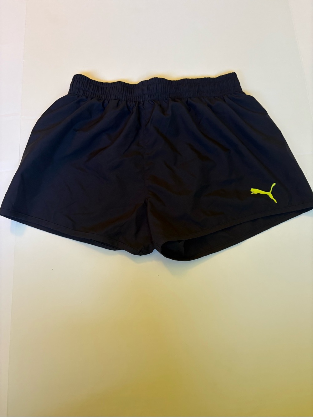 Puma Women's Black Athletic Shorts with Neon Yellow Logo